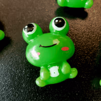 Koelkastmagneetjes 'Groene kikkers' 4 Groene kikker koelkastmagneet met grote ogen en een lachende mond