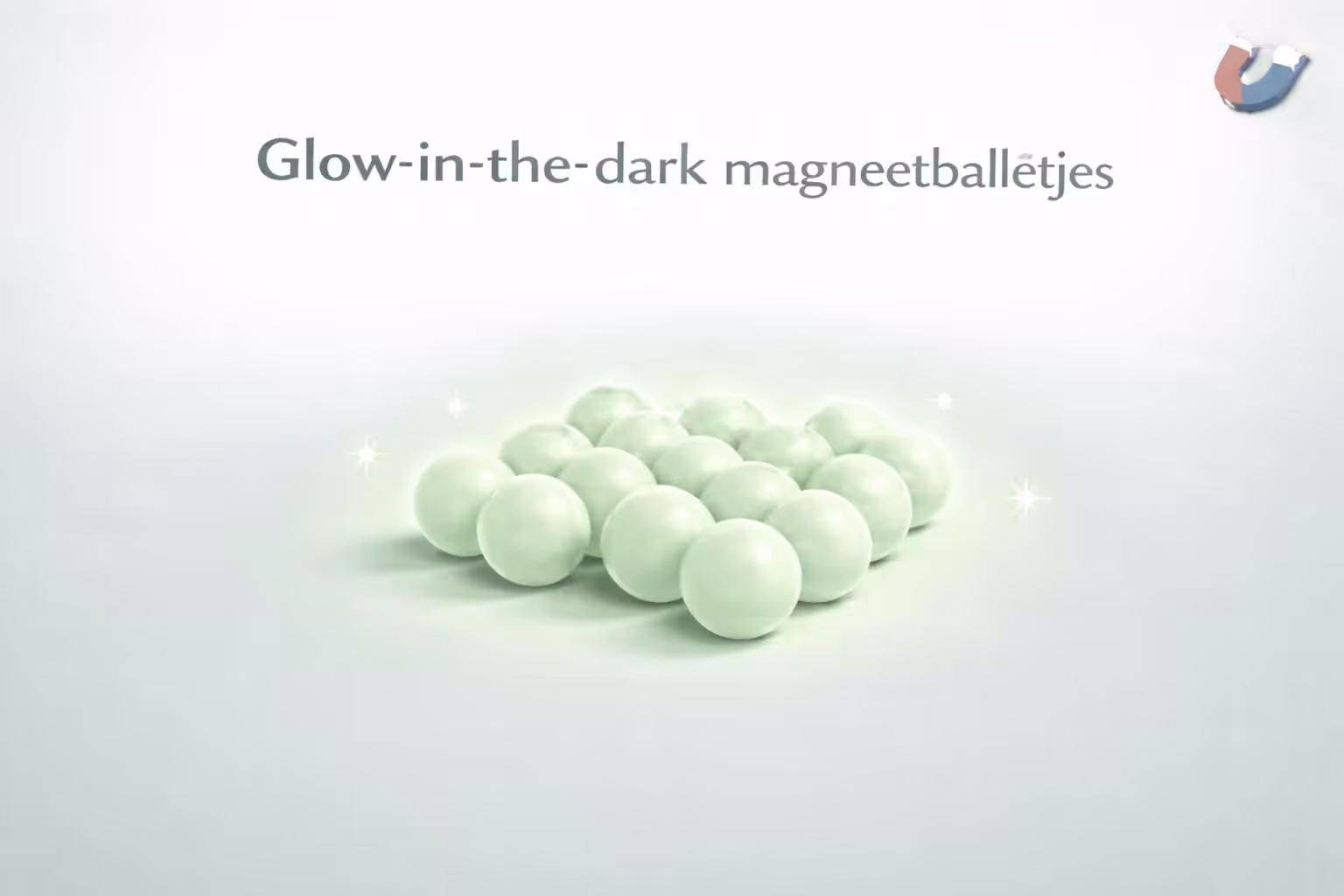 Groep glow-in-the-dark magneetballetjes met subtiel licht om het gloeien te tonen – MagneetjesWinkel.nl